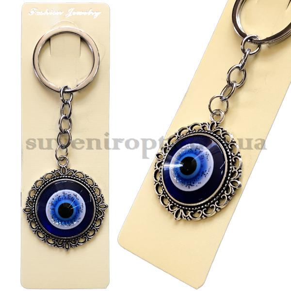 Брелок   в упаковке  металлический  в узорах  от сглаза  (12)