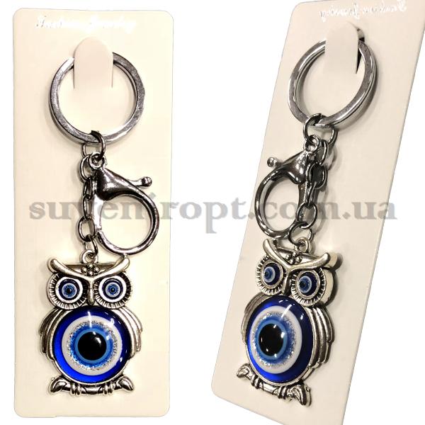 Брелок в упаковці металевий сова очі живіт від пристріту (12)