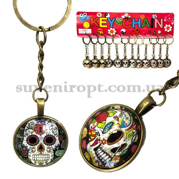 Брелок  металический с стеклом череп (12)