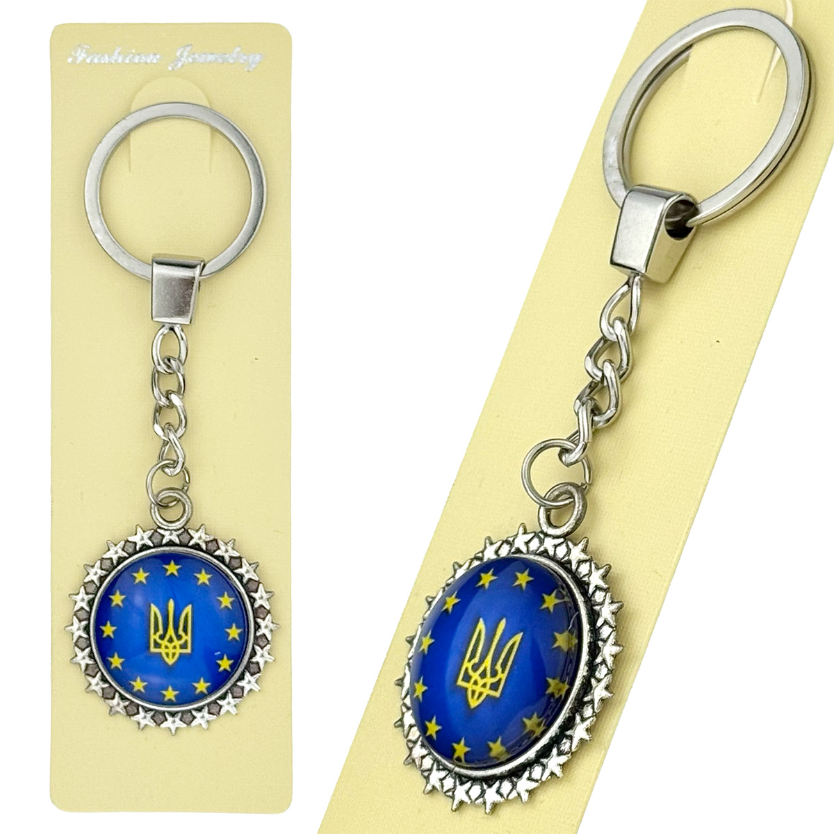 Брелок в упаковці обʼємне скло герб євро  25 мм метал зірочки (12)