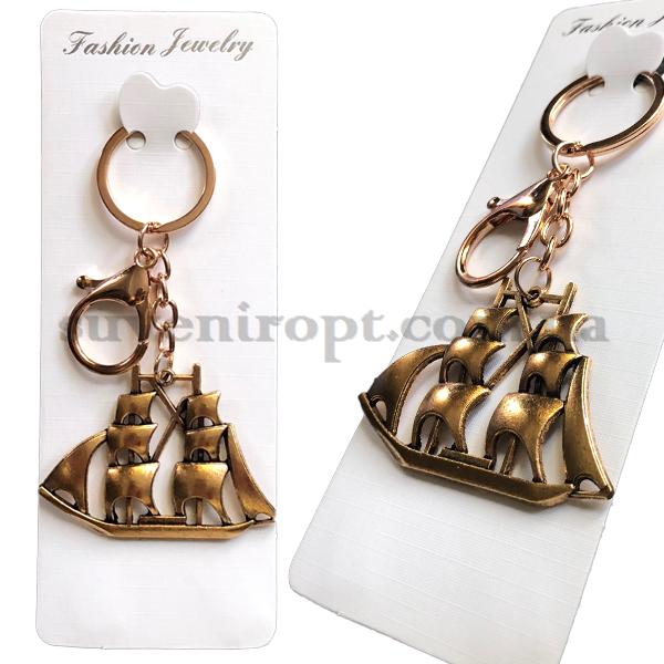 Брелок в упаковке корабль металлический золотой (12)